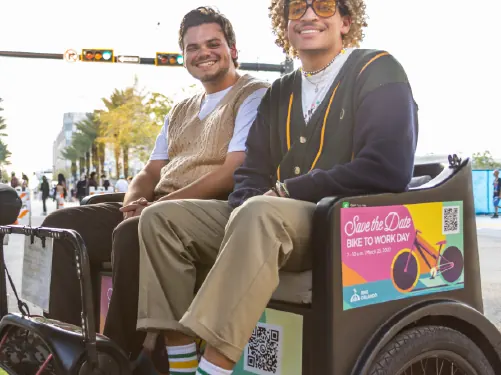 Guests on a sponsored pedicab ride