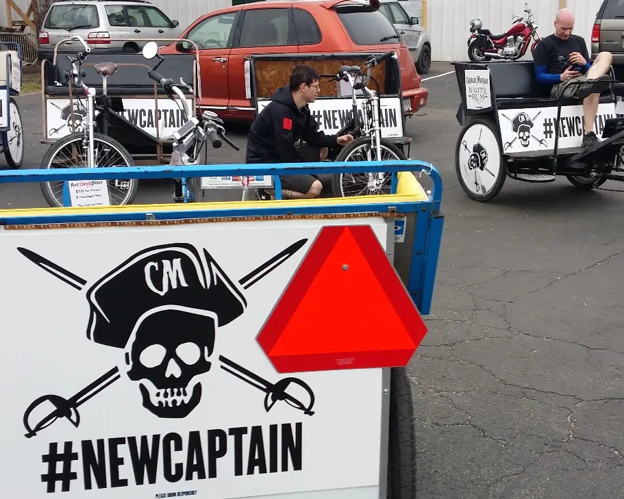 Captain Morgan pedicabs staged in the lot before SXSW