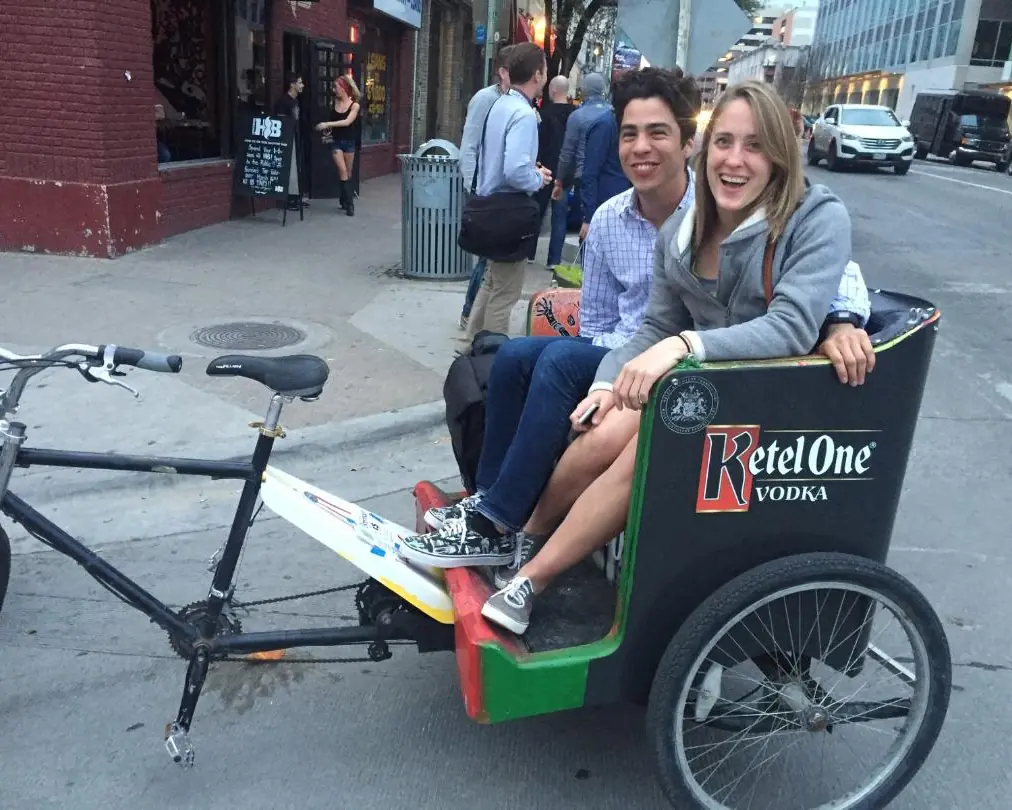 Couple riding a Ketel One pedicab