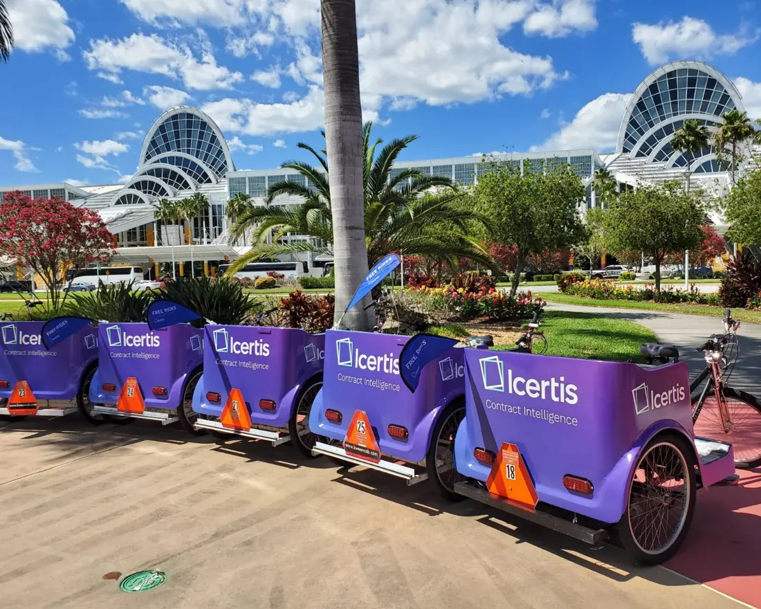 Icertis-branded pedicab fleet lined up outside the Orange County Convention Center during SAP Sapphire