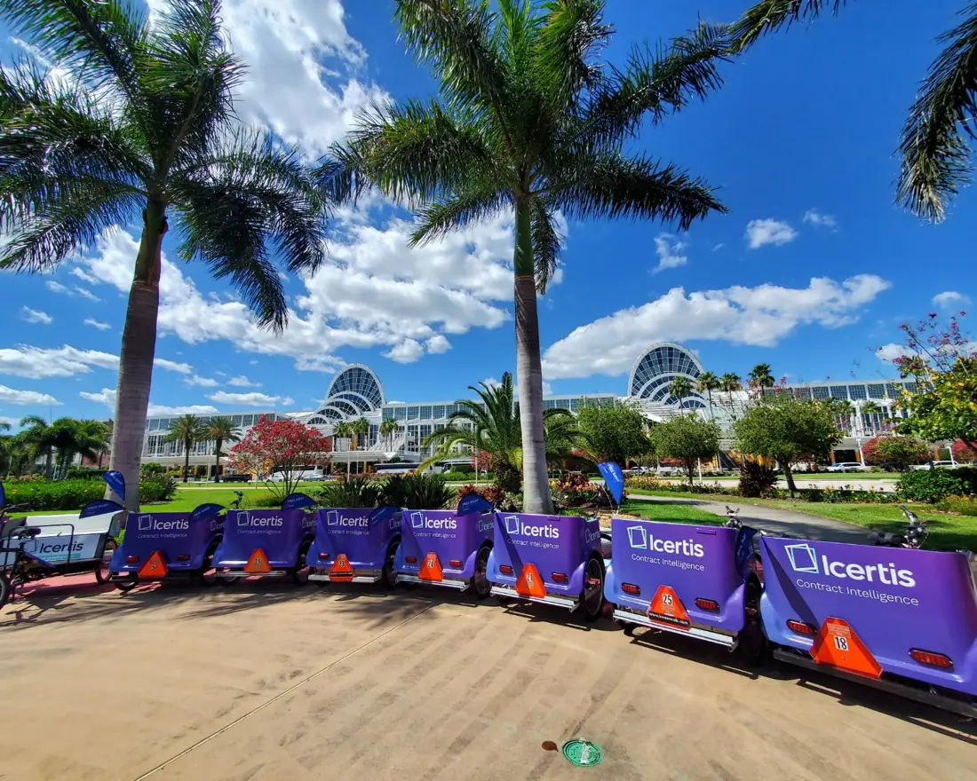 Long row of Icertis pedicabs along the Orange County Convention Center drive