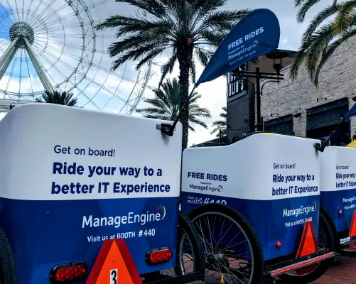 ManageEngine-branded pedicabs at a convention