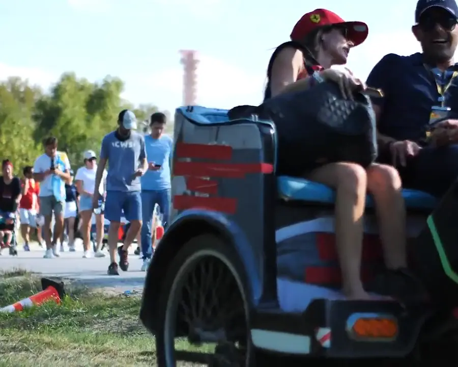 Riders in a Kween Cab pedicab on race weekend
